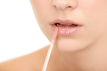 Image showing Lips, lipstick application and beauty with woman and closeup of cosmetic product on white background. Skin, glow and matte gloss with brush, lipcare for wellness and hydration with makeup for shine