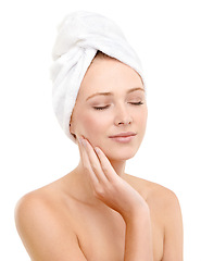Image showing Eyes closed, skincare and woman touch face in studio isolated on a white background. Spa, hand and person with towel in treatment for dermatology, wellness or glow of soft skin with makeup cosmetics
