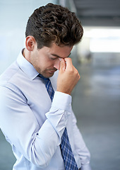 Image showing Tired, frustrated and business man with stress, burnout or anxiety for financial crisis in office. Headache, depression and serious professional with bankruptcy, taxes or fail challenge with mistake