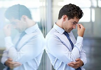 Image showing Headache, stress and business man with burnout, tired or anxiety for financial crisis in office. Frustrated, depression and serious professional with fatigue, thinking or fail with regret for mistake