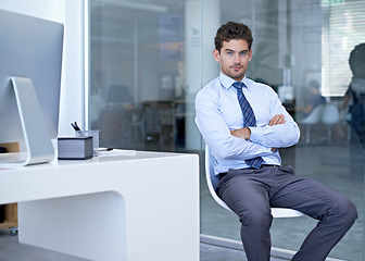 Image showing Portrait, business and man with arms crossed, employee and lawyer with confidence in a workplace. Person at his desk, legal aid and attorney with pride and corporate with professional and startup