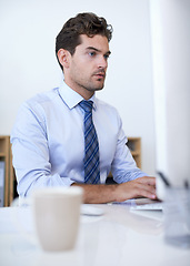 Image showing Thinking, employee and man with a computer, typing and internet with research and planning. Person, accountant and financial adviser with a pc and connection with company blog and reading tech news