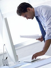 Image showing Businessman, computer and paperwork or typing for online report for research project, review or investment. Male person, legal document and financial planning in America for loan, accounting or web