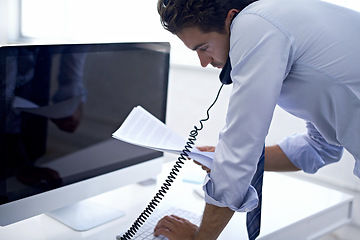 Image showing Businessman, phone call and paperwork at computer for conversation with client for financial advice, loan or investment. Male person, telephone and documents in New York office, network or research