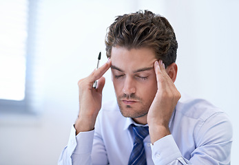 Image showing Headache, stress and business man with burnout, pain and anxiety for overwork in office. Migraine, depression and professional massage temples for fatigue, sick and tired agent frustrated in company