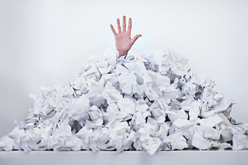 Image showing Person, hand and paper pile or trapped in deadlines for work responsibilities for overwhelmed, exhausted or problem. Fingers, buried and employee reaching for help or business, burnout or documents