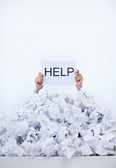Image showing Person, desk and hands with pile of paperwork, sign and help with burnout, stress and administration. Debt, bills and worker lost in documents, overworked and overwhelmed with pressure in office.