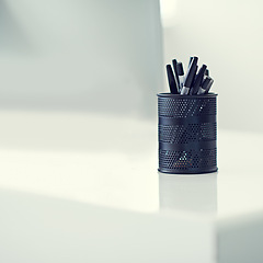 Image showing Pen, container and desk as writing stationery in office for organization of tools supply for drawing, signature or creative. Marker, holder and storage in New York or equipment, college or school