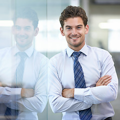 Image showing Businessman, portrait and office for formal, confidence and in professional workspace. Male person, arms crossed and smile for ambition, startup and entrepreneur for career and project management