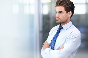 Image showing Businessman, face and serious with arms crossed in office for professional career in finance, thinking and confidence. Entrepreneur, person and employee with relax, thoughtful or mockup space at work