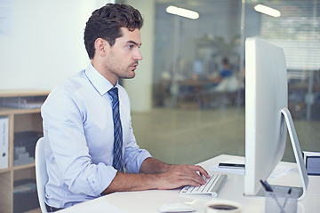 Image showing Business, accountant and man with a computer, typing and internet with research and online reading. Person, employee and financial adviser with a pc and connection with company website and technology