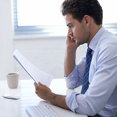 Image showing Businessman, paper and thinking in office for report, analysis and brainstorming with strategy at desk. Professional man, documents and reading with planning for budget, schedule or agenda at work