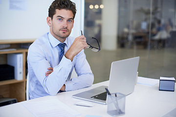 Image showing Businessman, portrait and laptop office with confidence at desk as financial advisor, planning or investing. Male person, glasses and face in New York or corporate employee, accounting or research