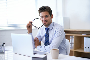 Image showing Businessman, portrait and smile at laptop in office with confidence as financial advisor or investment, loan or budget. Male person, face and glasses as broker or online planning, research or funding