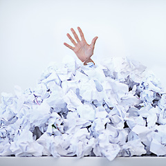Image showing Person, business and hand or paper pile as corporate deadline or buried in documents for work stress, problem or responsibilities. Fingers, trapped and employee reach for help, burnout or overwhelmed