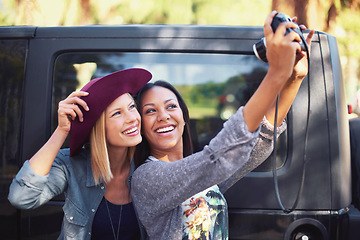 Image showing Selfie, photography and friends on road trip with journey, travel and happy together by car, vehicle or van. Young people, women or photographer with camera for profile picture or memory on holiday