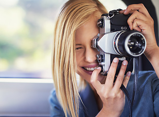 Image showing Camera, photography and woman on road trip with journey, travel and creative hobby or photoshoot. Young freelancer, traveler or photographer shooting in car for digital memory, vacation and holiday