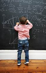 Image showing Math, blackboard and child writing in school for learning, development and young boy genius in classroom. Kid, numbers and formula on chalkboard with knowledge for education, growth and solution