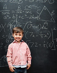 Image showing Smart, kid and math on chalkboard for school, learning and education with happy portrait and confidence. Genius and clever child, boy or student with equation, numbers and test for IQ or intelligence