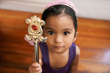 Image showing Girl, portrait and cute costume with wand for halloween, fantasy and dress up with fairytale clothes. Child, home and wings for creative, adorable fashion and innocent with magic for wish from above