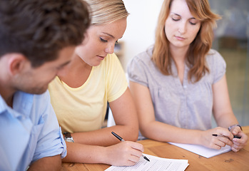 Image showing Teamwork, business people and paperwork for planning, brainstorming or discussion in startup office. Document, group or creative employees together in meeting, collaboration or cooperation of writers