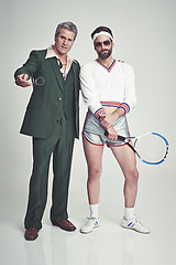 Image showing Men, retro and fashion with confidence in studio on white background and smart look with suit and tennis racket. Vintage style and glamour with trends for outfit, elegance and clothes with class