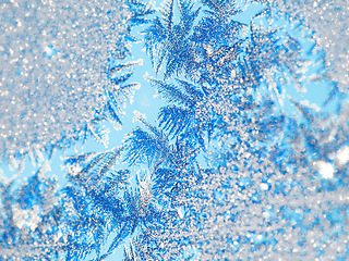 Image showing Ice, macro and snow crystal on glass with winter abstract pattern and beauty in nature. Frost, background or wallpaper with closeup on frozen weather, texture outdoor or detail from snowstorm