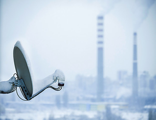 Image showing Satellite, dish and winter snow in city for television signal in cold weather or infrastructure, environment or cable. Technology, equipment and freezing climate in Canada town, broadcasting or ice