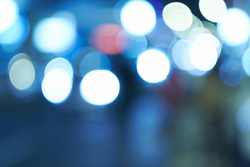 Image showing Bright lights, abstract and night with design, city and graphic against a blue background. Creativity, bokeh and blur with aesthetic and shine with colours and effect with pattern, texture and glow