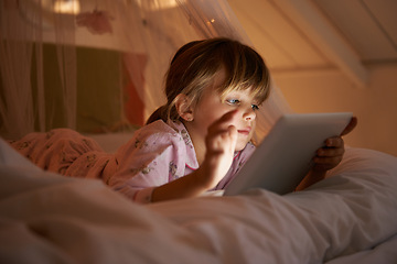 Image showing Child, bedroom and tablet at night, relaxing and watching with technology for streaming or browsing. Little girl, tech and internet for online games or digital reading with touch and playing in bed