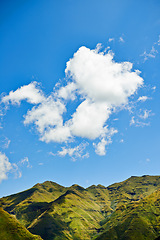 Image showing Sky, clouds and mountains for landscape background, environment and eco friendly nature in Europe. Aerial view of countryside, hill and river for green land, sustainability or summer weather in italy