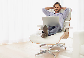 Image showing Businessman, relax and sofa with computer online for remote work, living room and home office for freelance job. Male person, social media and browsing or research on laptop, couch and smile