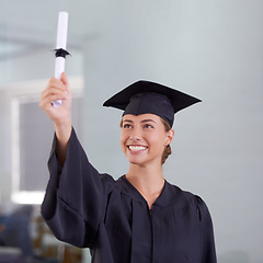 Image showing Graduation, certificate and happy woman celebrate at university for achievement. Degree, graduate or smile of young student with diploma scroll for education, success or scholarship at college campus