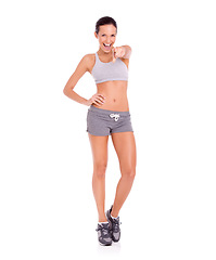 Image showing Studio, woman and pointing in portrait for fitness promotion and exercise announcement or news of gym discount. Model, happy face and aerobics offer to winner and workout plan by white background