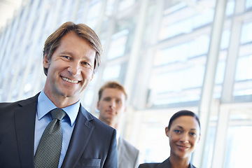 Image showing Mature businessman, portrait and pride in leadership, office and confidence in management. Business people, teamwork and collaboration or support in workplace, smiling and ceo at startup company