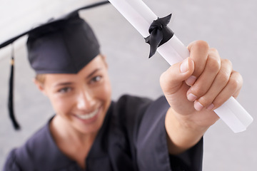 Image showing Graduate, certificate and hand of happy woman in celebration for success at college. Face, graduation and closeup of student with diploma for education, achievement and smile for award in university