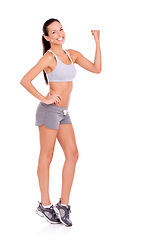 Image showing Portrait, fitness or flexing with woman, challenge or progress isolated on white studio background. Health, mockup space or strong with model or achievement with exercise goals or training with smile