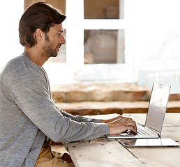 Image showing Laptop, coffee shop and remote work with blogger man typing article or content at table outdoor. Business, computer and adult education with young person at cafe or restaurant as entrepreneur