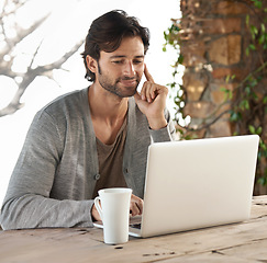 Image showing Businessman, laptop and reading or research outdoor with remote work, coffee and freelance writer. Entrepreneur, person and face or technology for relax, typing and online planning in nature at cafe