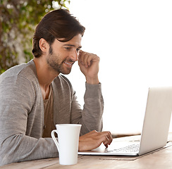 Image showing Businessman, laptop and reading or research outdoor with coffee for remote work, happy and freelance writer. Entrepreneur, mature person and technology for relax and online planning in nature at cafe