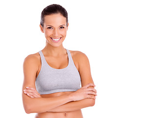 Image showing Studio, woman and confident in portrait for exercise in gym clothes, fitness and arms crossed by white background. Spain model, face and positive for aerobics workout and training for strong body
