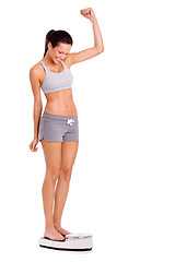 Image showing Achievement, success and woman on scale in studio for weight loss, fitness or healthy diet for wellness. Body, exercise and person with motivation for workout, detox or gut health on white background