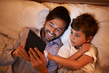 Image showing Bedroom, father and son with tablet, night and family with ebook and connection with social media. Dad, house and boy with technology and bedtime story with lights and bonding together with hobby