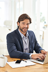 Image showing Desk, laptop and portrait of businessman typing report, email or research with financial analyst in office. Consultant, business advisor or man with computer writing online feedback review at startup