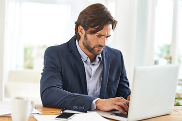 Image showing Desk, laptop and businessman with research, thinking and paperwork and financial analyst in office. Consultant, business advisor or man typing email, writing report and planning ideas for startup.