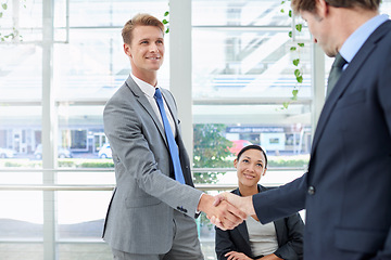 Image showing Shaking hands, collaboration and business people in office for agreement, partnership or deal. Smile, meeting and professional men with handshake for onboarding or hiring welcome in workplace.