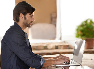 Image showing Businessman, laptop and typing of email in cafe with remote work, copywriting or freelance employee. Entrepreneur, mature person or technology for reading, writing or online planning in coffee shop