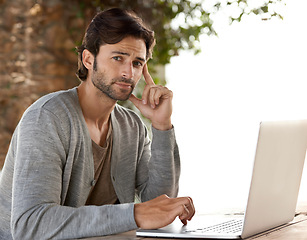 Image showing Businessman, laptop and portrait for research outdoor with remote work, relax and freelance writer. Entrepreneur, person and face with technology for email, typing and online planning at cafe