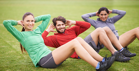 Image showing Friends, sit ups and fitness on field for portrait, training or happy for abdomen exercise in summer. People, man and women with wellness with smile, core workout and group on grass lawn in Australia