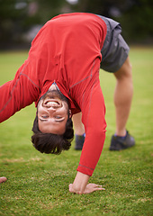 Image showing Man, exercise and grass with stretching back, arching and workout for fitness in summer. Person, training and outdoor in portrait for muscle health with balance, wellness or nature on lawn in England